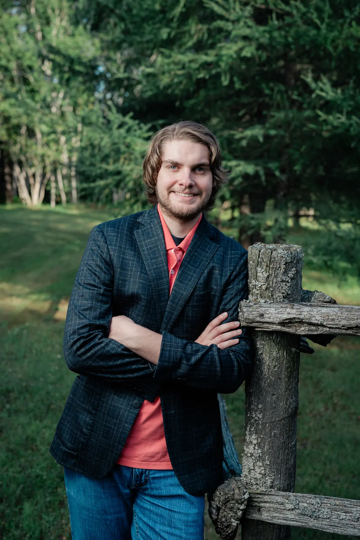 Keegan Dutrisac by a split-rail fence